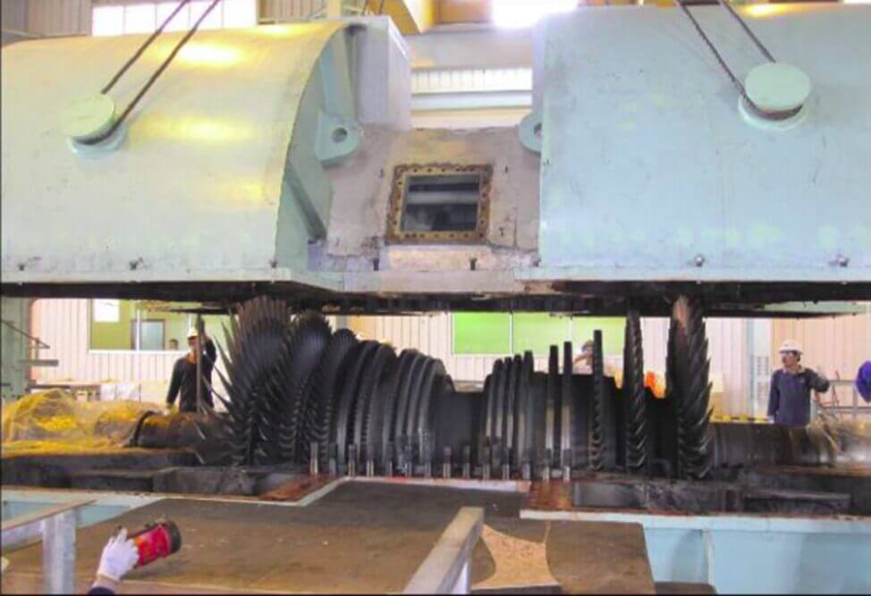 Lifting the top casing to reveal damage on the stage and blades.