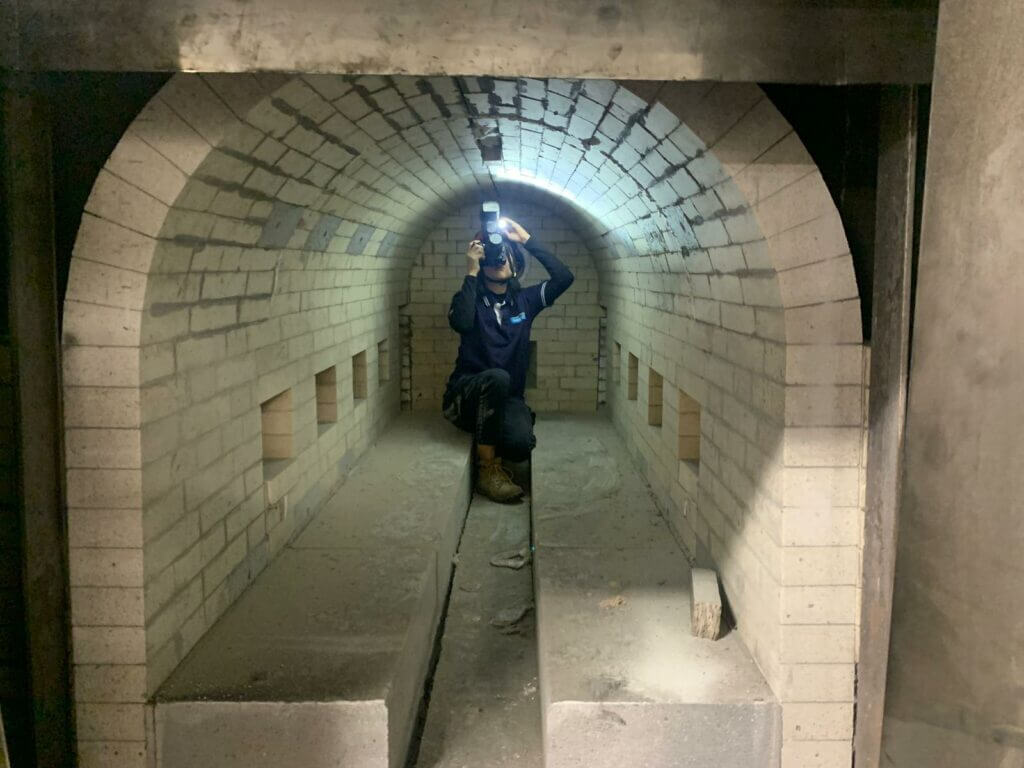 Image of Senior Associate, Jessica Ng, investigating the cause of an explosion inside a cremator