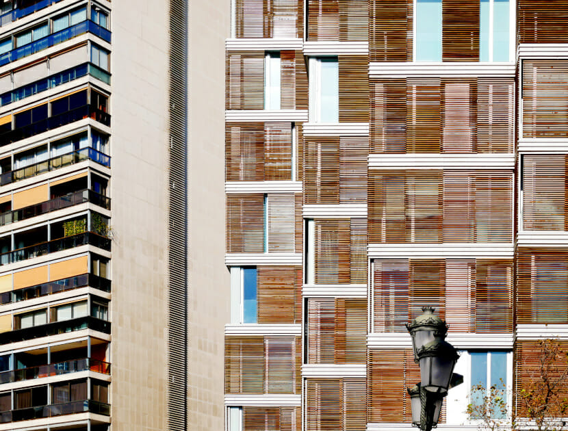 building façade with wood cladding and solar shading