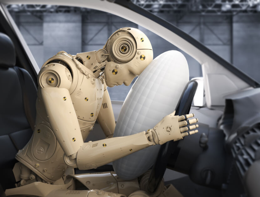 Crash test dummy hitting air bag inside car